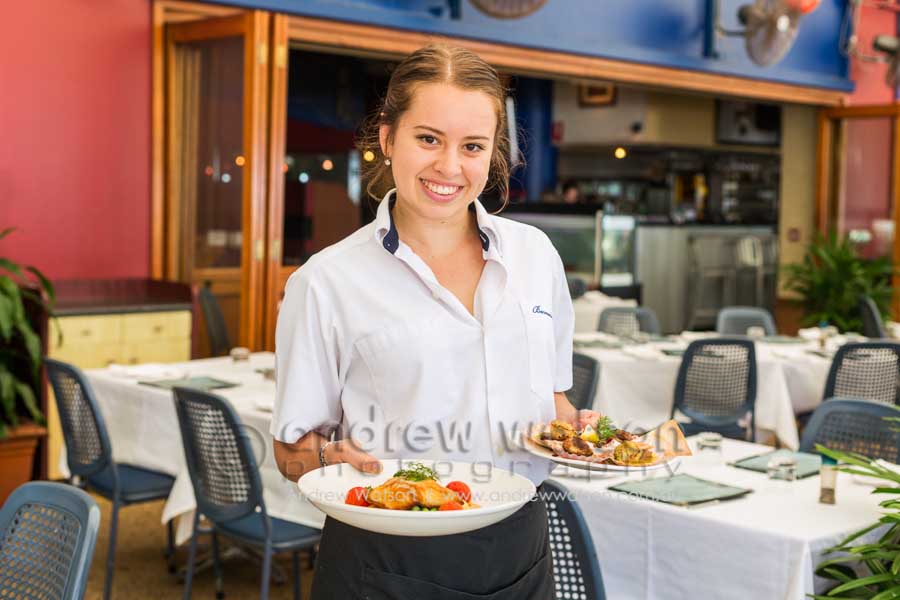 Picture of waitress with seafood dishes on offer Barnacle Bills, Cairns