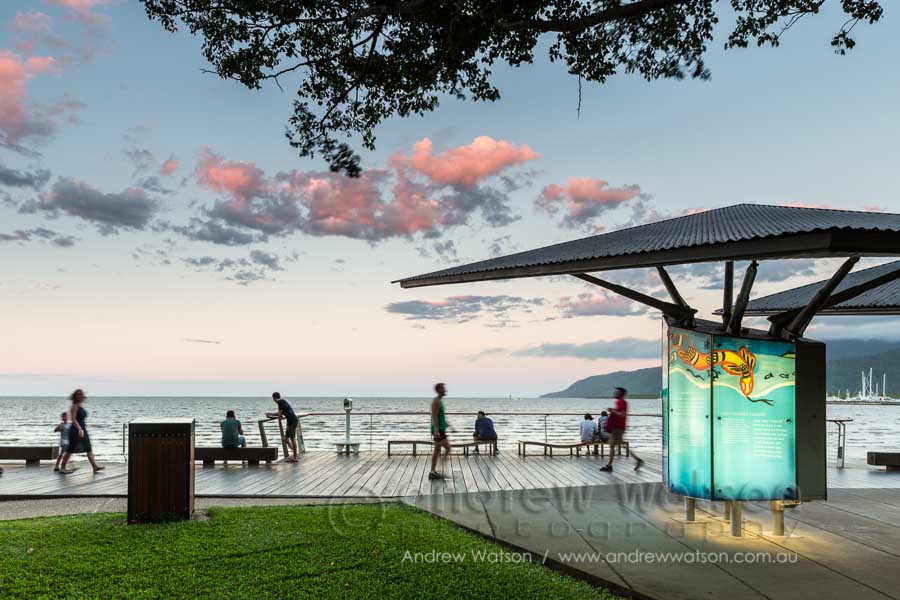 Busy scene along the Cairns Esplanade Boardwalk at twilight