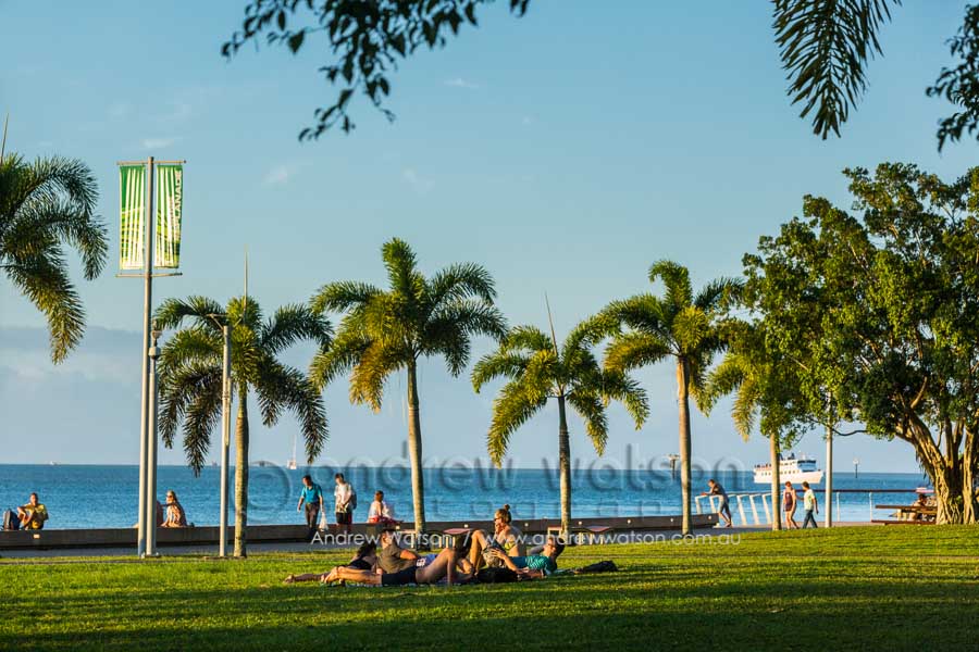 People relaxing on the Esplanade lawn, Cairns