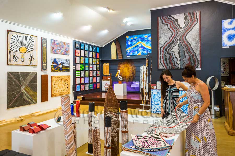 Woman shopping for indigenous art in Ngarru Gallery, Port Douglas