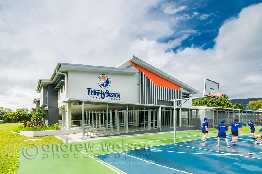 Images of kids playing basketball in front of new Cairns building