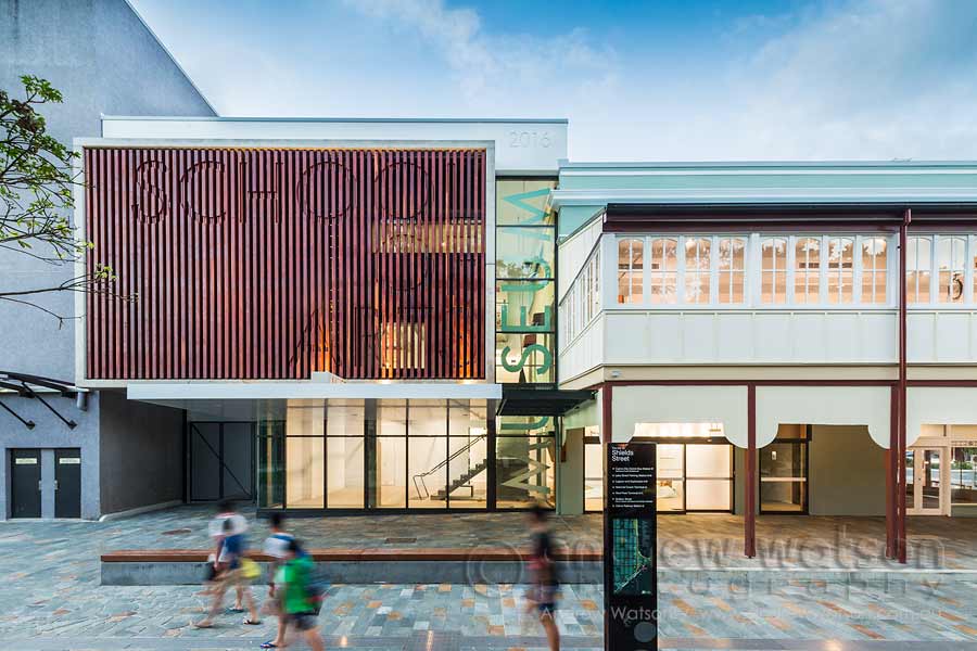 Image of people walking past the renovated School of Arts building in Cairns