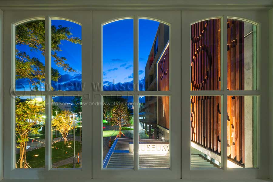 View of new School of Arts building extension, Cairns, through heritage building windows