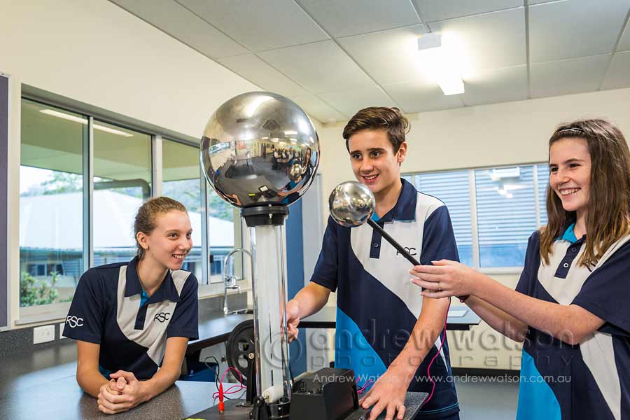 Image of school students working with an electrostatic generator