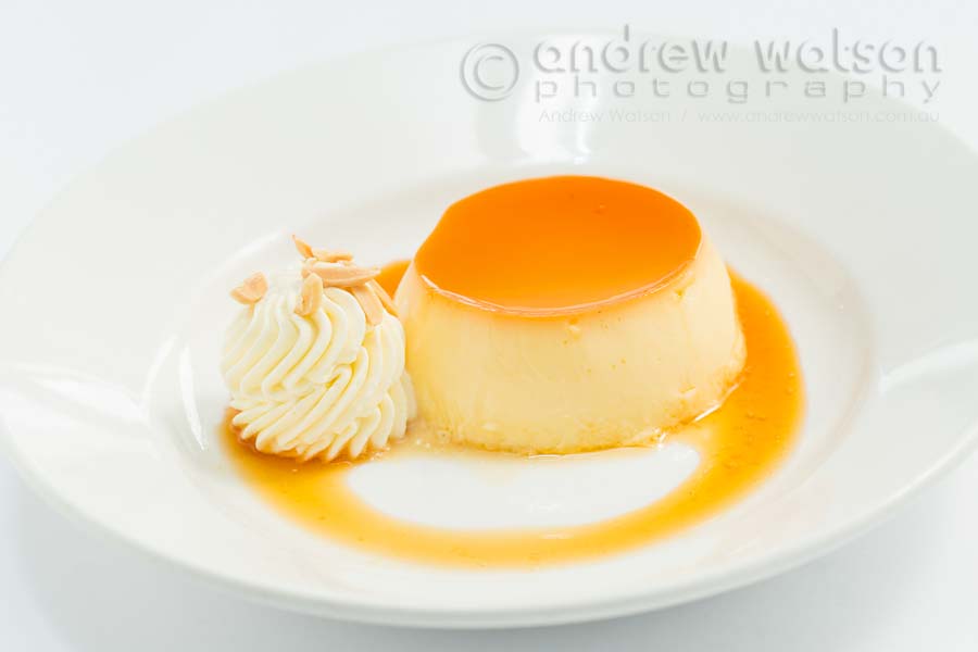 Image of a creme brulee served with cream