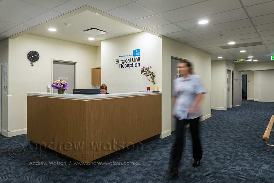 Image of staff walking through private hospital reception area