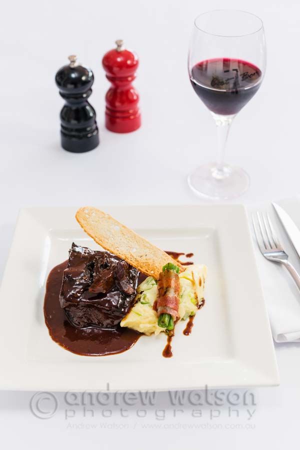 Image of Braised red wine beef cheek dish served with potato mash