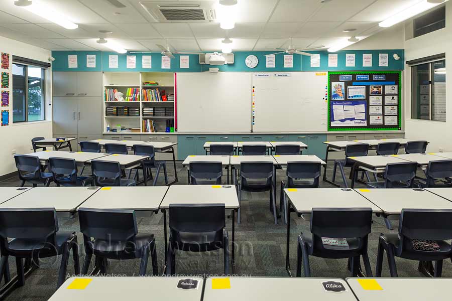 Image of school desks in an empty classroom