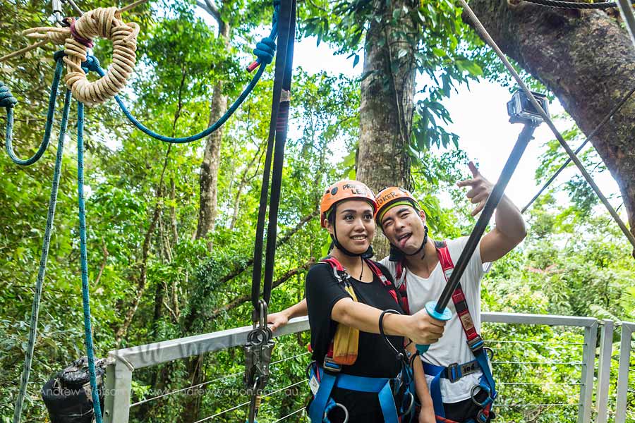 Asian couple with self-stick on Daintree rainforest ziplining tour