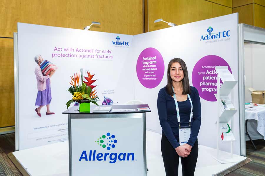 Image of staff in front of trade exhibit booth at ANZSGM 2016