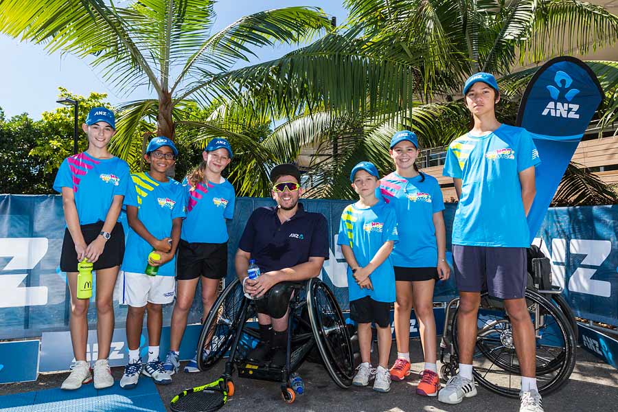 Image of Dylan Alcott and helpers at ANZ Cairns Charity Tennis Challenge