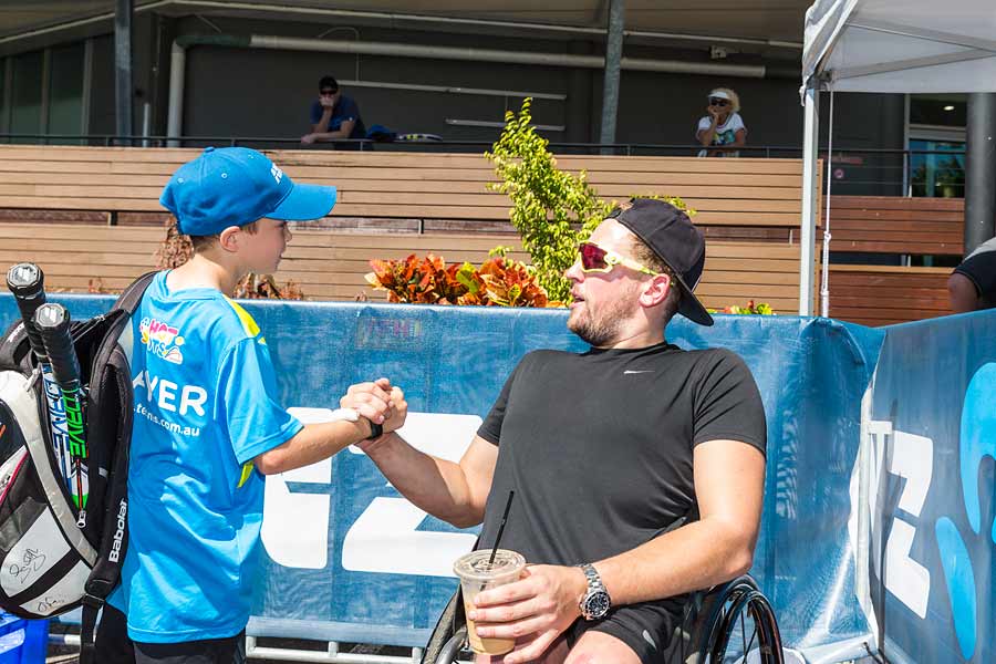 Image of Dylan Alcott with kids at ANZ tennis clinic in Cairns
