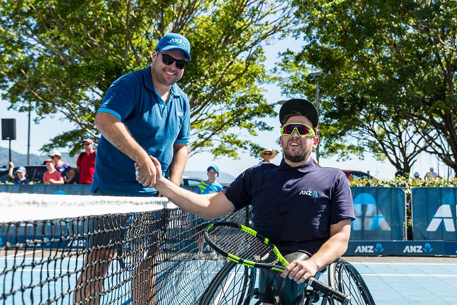 Image of Dylan Alcott and business member at Cairns Tennis Charity Challenge