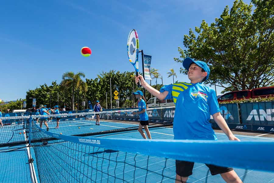 Image of kids in action at ANZ ennis clinic in Cairns