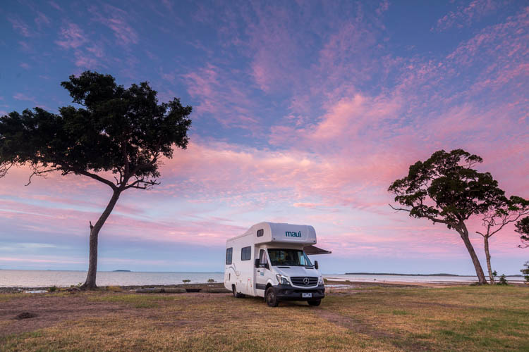 Image of campervan parked beside seaside at Clairview Beach