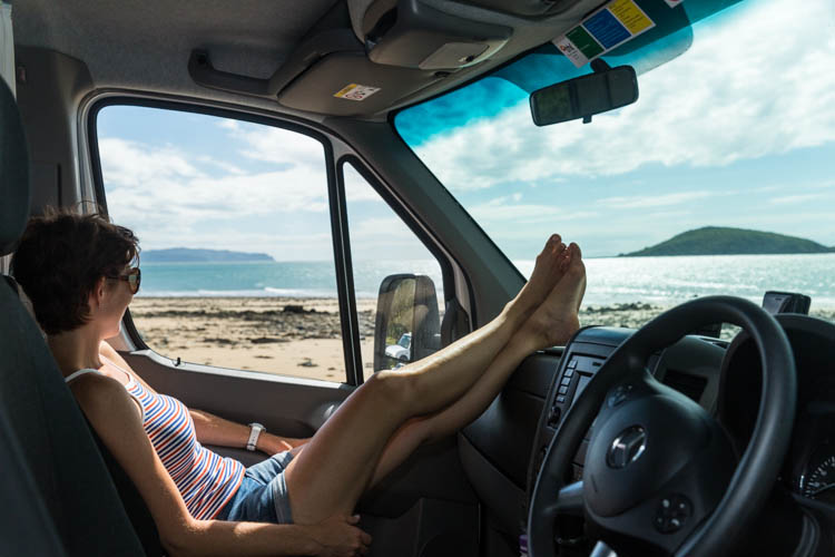 Image of woman relaxing with views from Motorhome, Mackay