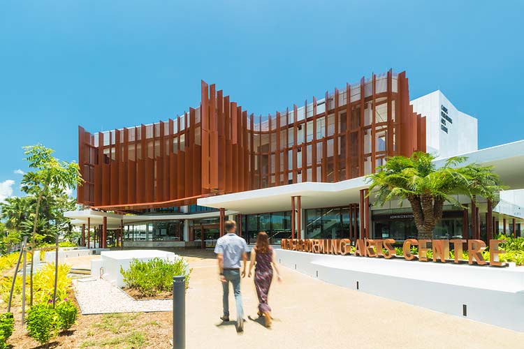 Couple walking toward the entrance of the Cairns Performing Arts Centre