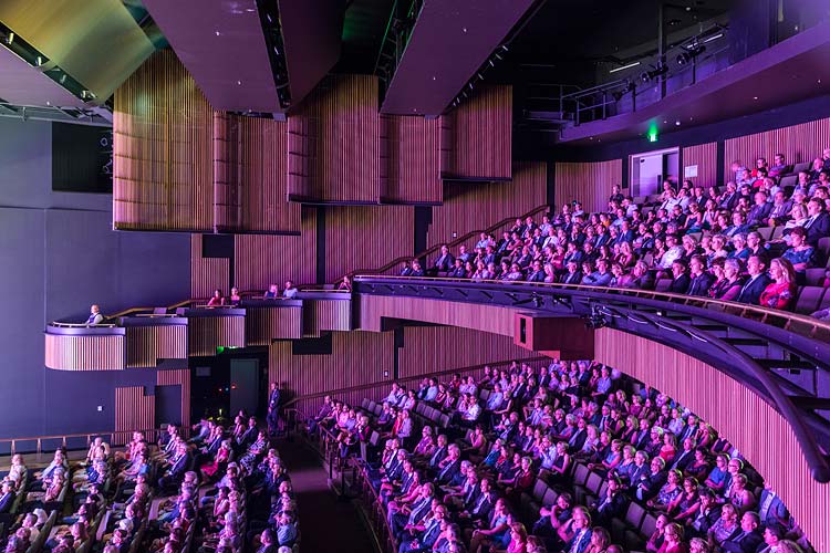 Interior of main theatre of Cairns Performing Arts Centre with people watching performance