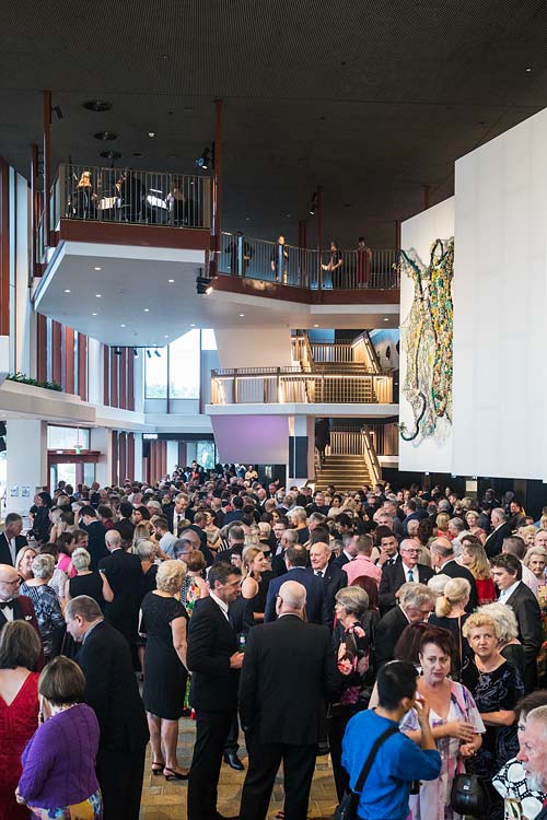 Theatre patrons socialising in the foyer area at Cairns Performing Arts Centre