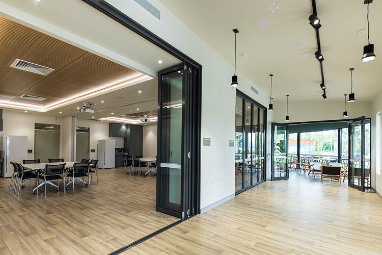 Interior of Wellbeing centre with meeting room and cafe entrance