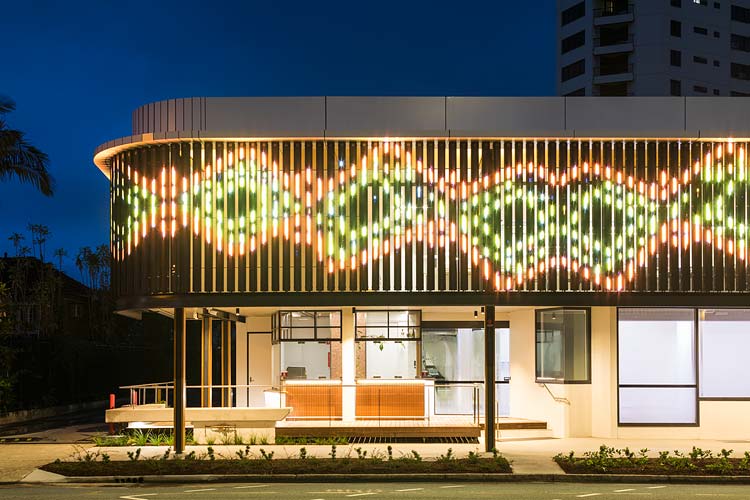 Exterior of Bulmba-ja Centre of Contemporary Arts in Cairns at night showing LED digital facade