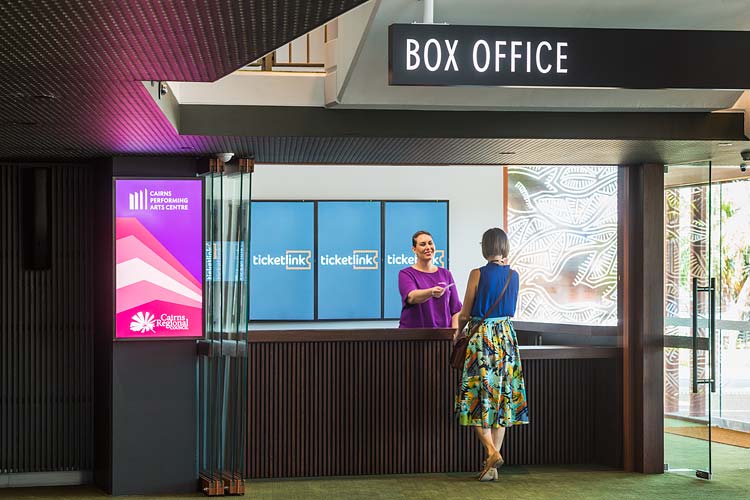 A customer getting tickets at Cairns Performing Arts Centre box office