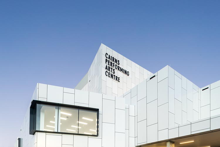 Exterior view of the Cairns Performing Arts Centre rear facade and flytower at twilight