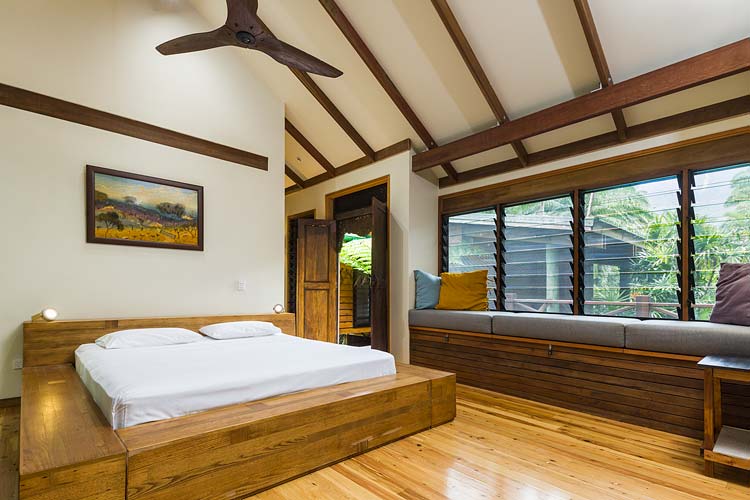 Bedroom interior with bench seating in Daintree holiday home