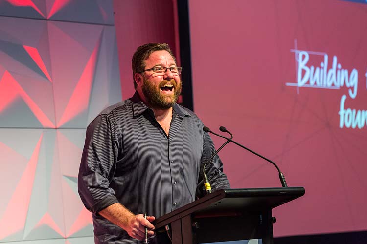 Shane Jacobson speaking onstage at Bridestone Conference