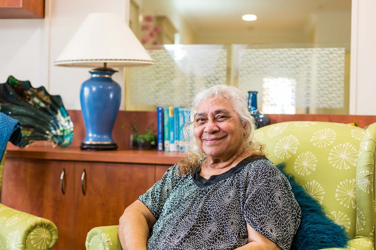 Portrait of a female resident of an aged care home in lounge room