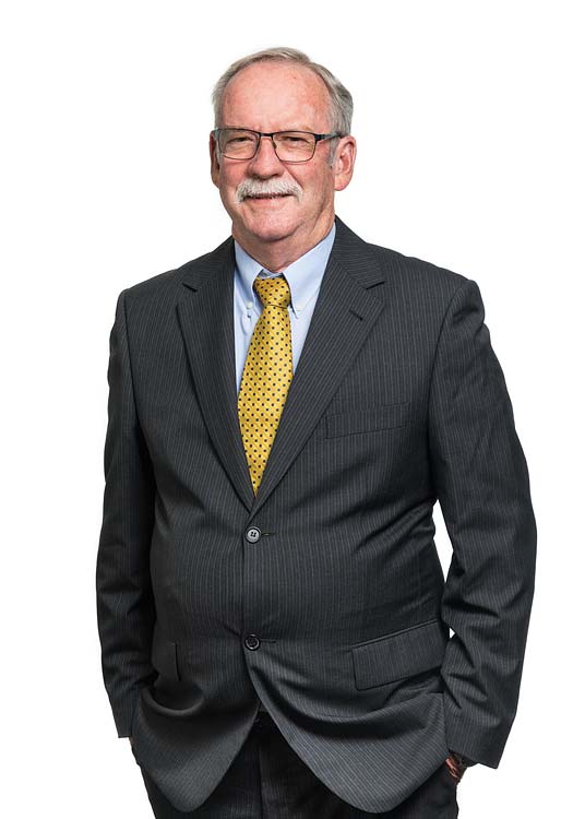 Corporate portrait of a male commercial property services agent with white background