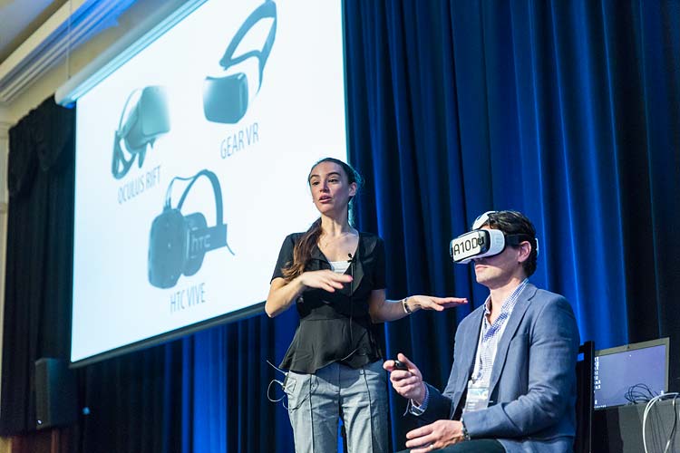 Speaker discussing use of virtual reality at medical conference in Cairns