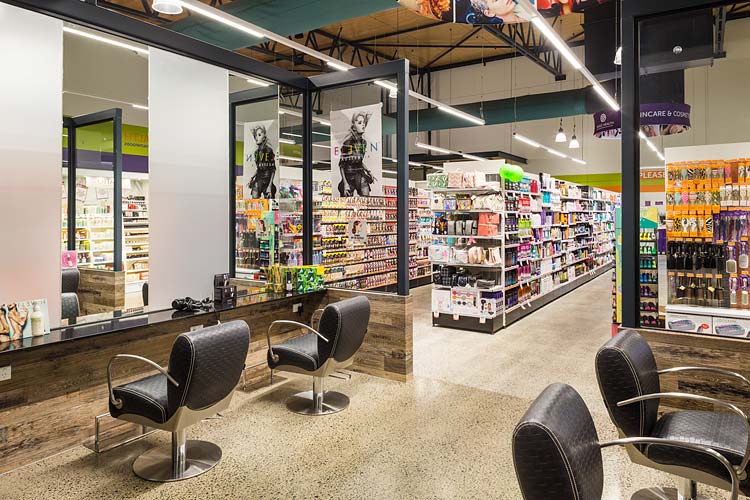 Interior of the Barr St Markets building showing hairdressing salon and pharmacy shelves