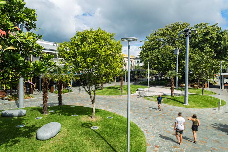 People walking through the urban park elements of the Shields Street Heart project in Cairns
