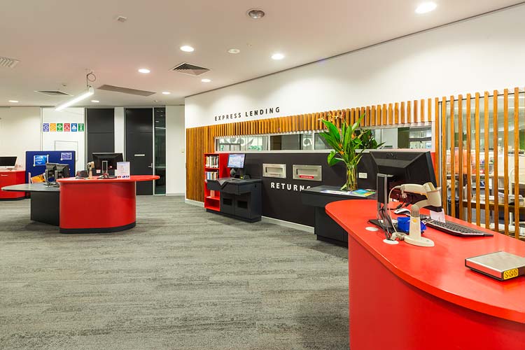 Interior of the James Cook University library showing book lending area