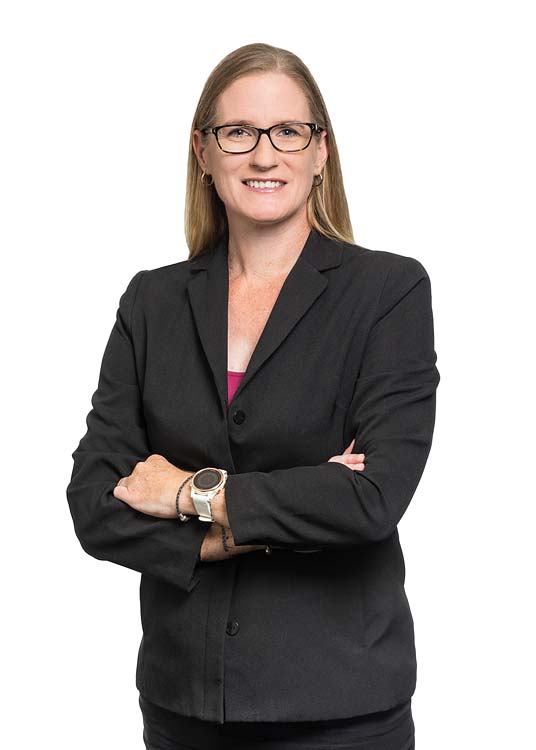 Corporate portrait of a female commercial property services agent with white background