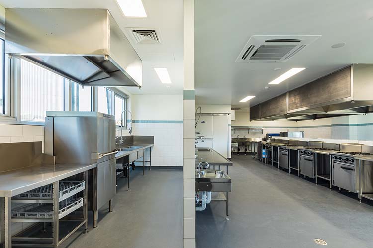 Interior of the St Monica’s College building extension showing commercial kitchen