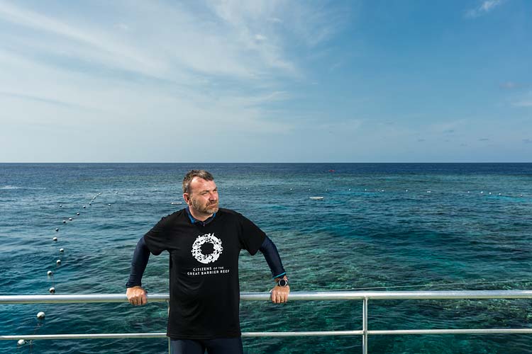 Portrait of Andy Ridley with a backdrop of the Great Barrier Reef