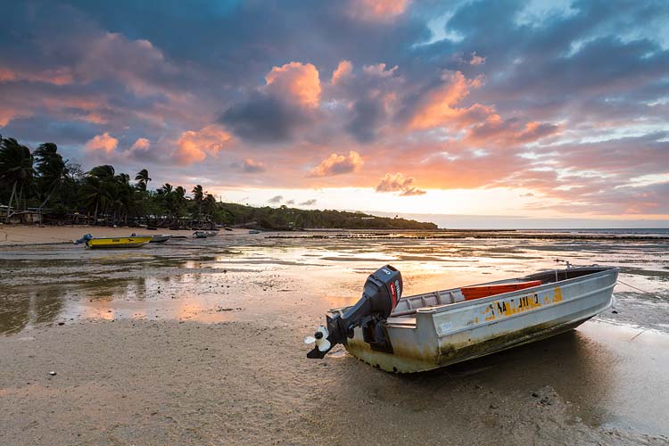 Dinghy on the beach at sunrise on Erub Island, Torres Strait