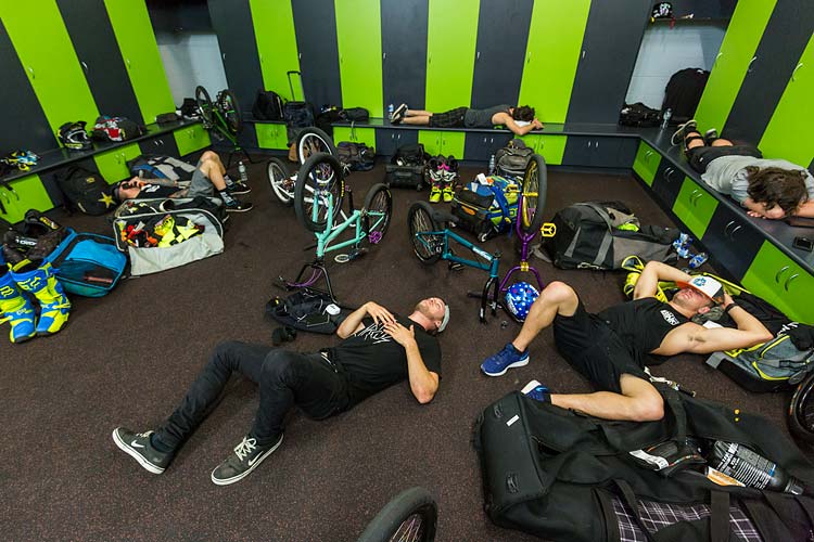 Image of Ryan Williams and other Nitro Circus performers sprawled out in the dressing room