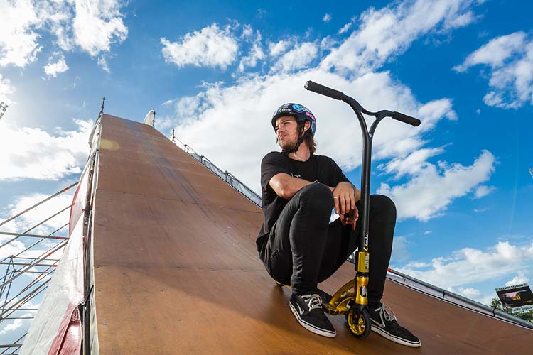 Portrait of Ryan Williams and his kick scooter on the "Giganta Ramp"
