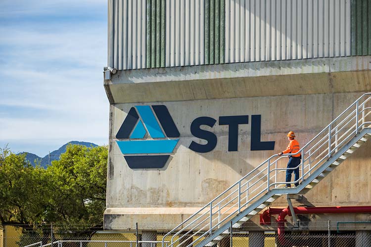 A worker looking at STL branding at the Cairns Sugar Terminal