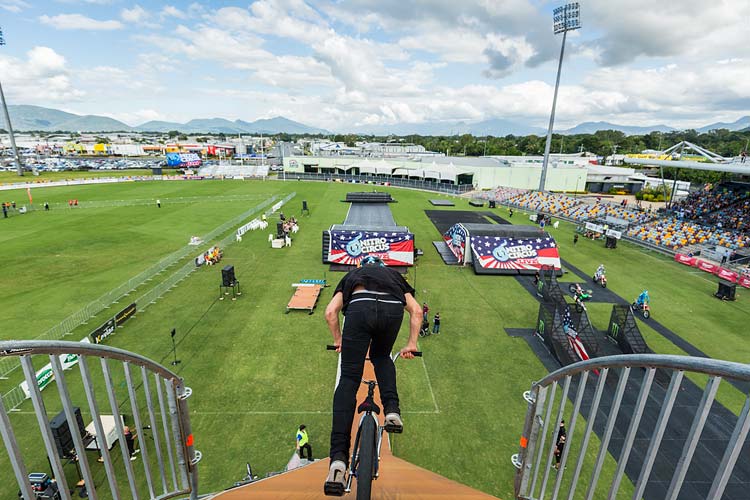 Ryan Williams riding down the Giganta Ramp on a BMX bike to for an aerial jump