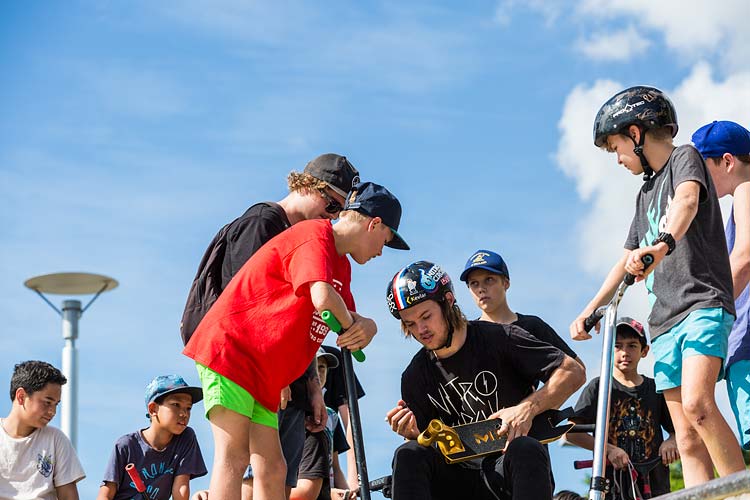 Ryan Williams of Nitro Circus signing autographs for young fans at a Cairns skate park