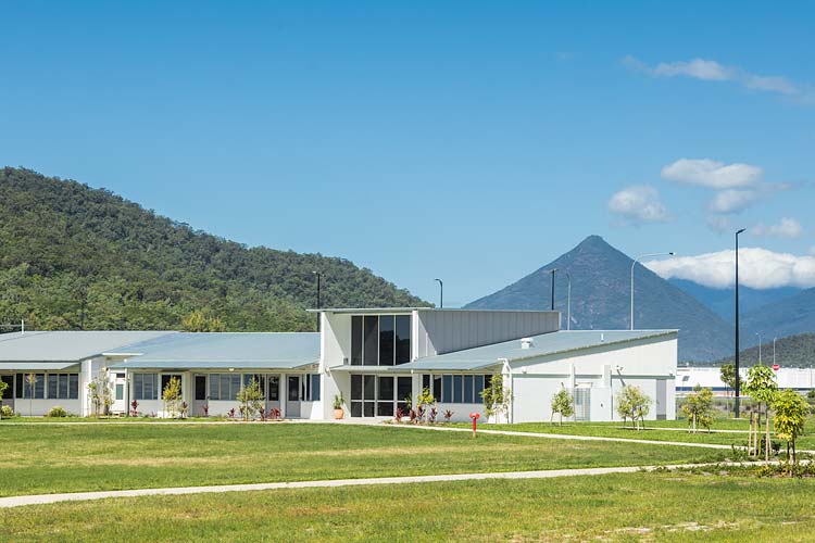Exterior of school administration building with hills beyond
