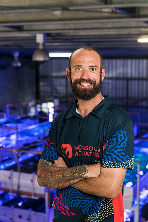 Portrait of a staff member at a hand-picked coral supply business