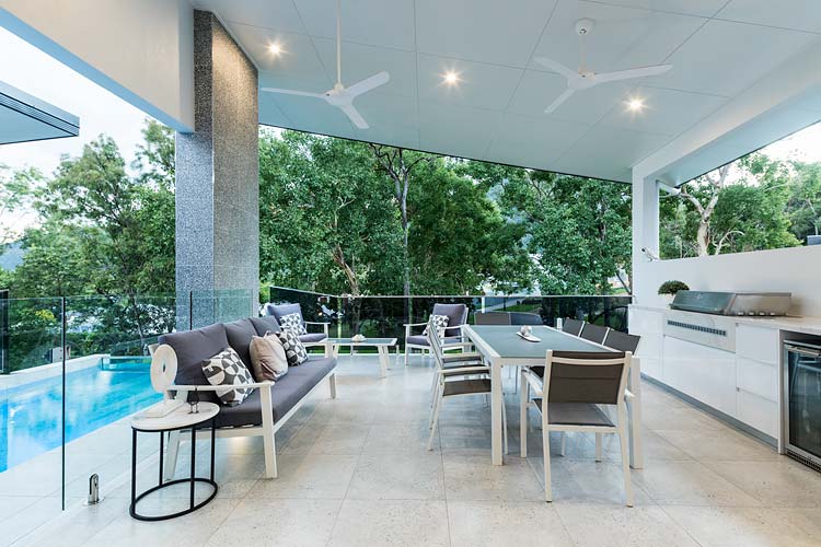 Outdoor entertaining area of residential home with green views