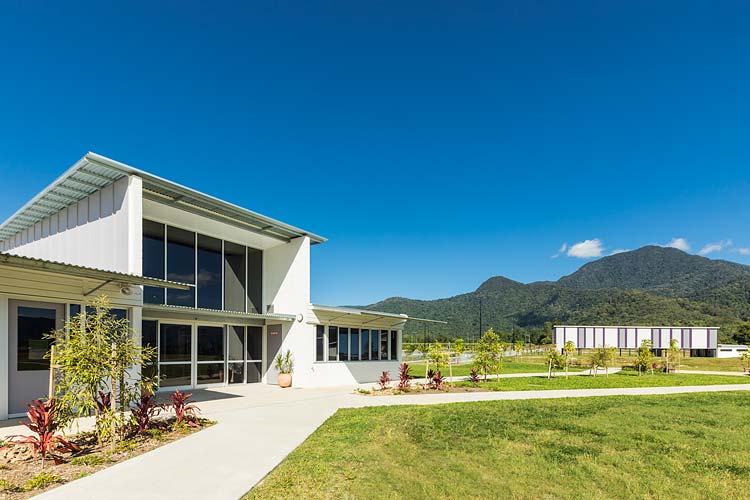 Exterior of new school administation building with hills beyond