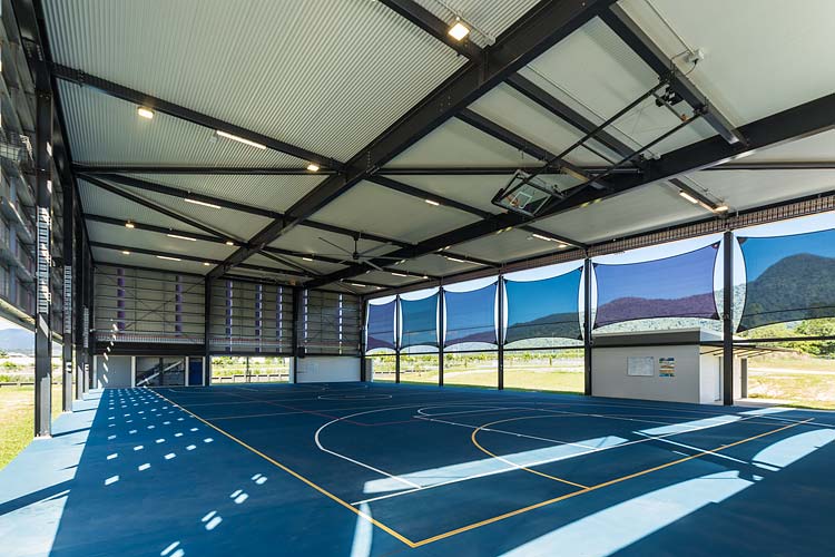 Interior of new school sports centre with covered basketball court