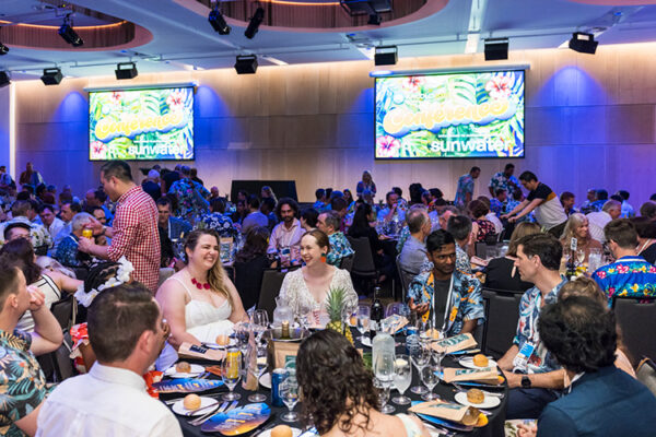 Delegates talking at table at a conference dinner